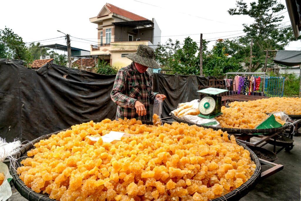 Large woven baskets filled with golden chunks of jaggery (gur), a natural immunity-boosting sweetener recommended in a winter diet in Ayurveda.