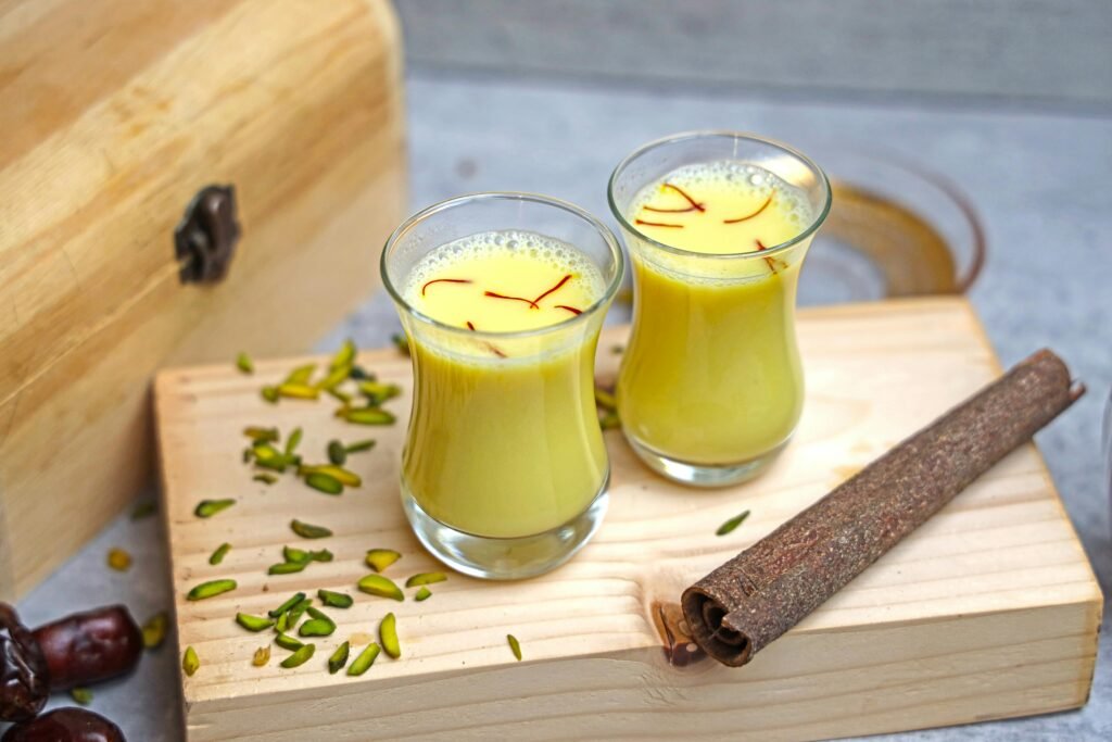 Two glasses of warm turmeric milk, or haldi doodh, a nourishing Ayurvedic drink to boost strength and immunity in winter.